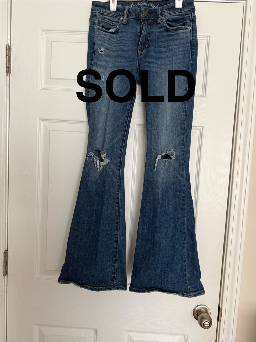 SOLD! AE Distressed 77 hi rise flare leg. Size 2